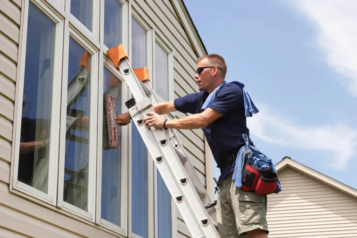 Banner from men cleaning window